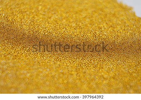 Abstract golden background with small beads 