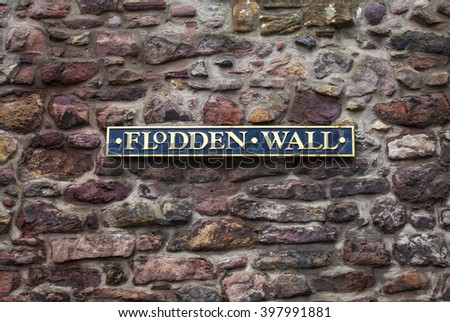 A plaque marking a section of the historic Flodden Wall in Edinburgh, Scotland.