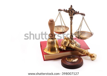 Antique scales and gavel, bell with an oak handle on the book