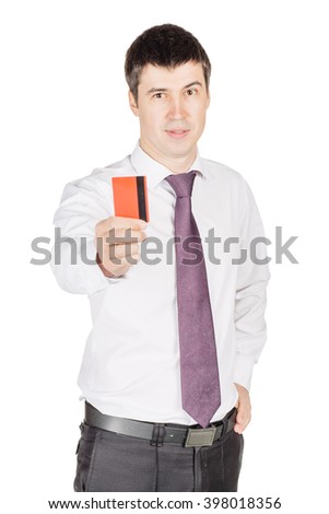 portrait of young smiling business man holding credit card.  isolated on white background. technology, shopping, banking and lifestyle concept
