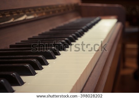 Piano keys on wooden musical instrument