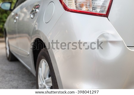 Backside of new silver car get damaged by accident Royalty-Free Stock Photo #398041297