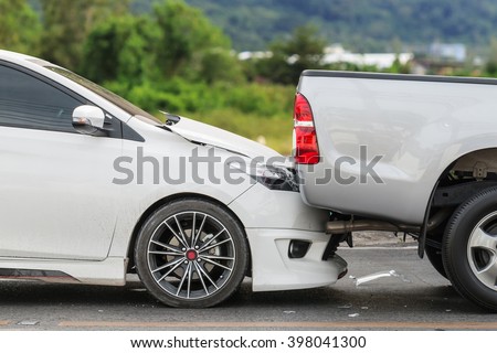 Car accident involving two cars on the road Royalty-Free Stock Photo #398041300