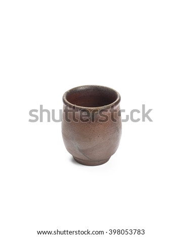 Brown ceramic cup isolated