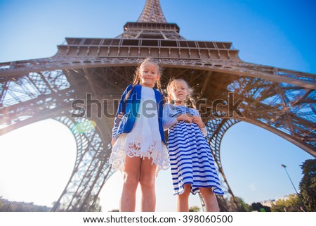 Adorable little girls in Paris background the Eiffel tower