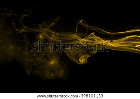 Gold smoke on black background 