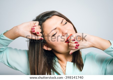 Portrait of a young woman stretching after sleeping