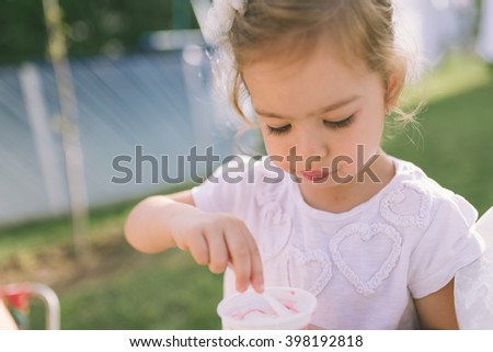 Little Girl Eating Ice-Cream