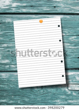 Close-up of one blank paper sheet frame with lines hanged by pin on aqua wooden boards background