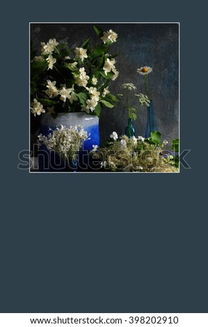 Floral greeting card or poster with copy space.  White flowers in blue vases.
Photo with texture enhancement