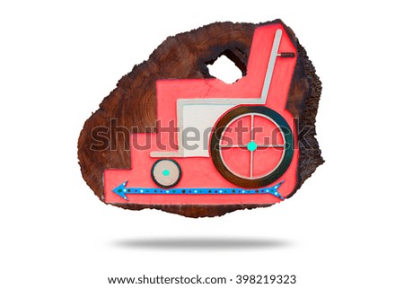 Wheelchair label on wood board, Background have Red color and Blue Sky arrow pointing to the left side