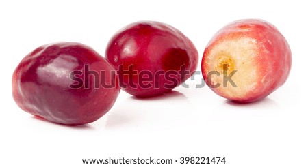 three red berries of grapes isolated on white background