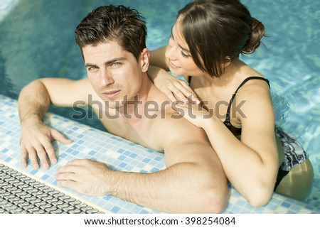 Young couple relaxing together in the pool