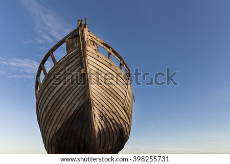 Old fishing boat against blue sky