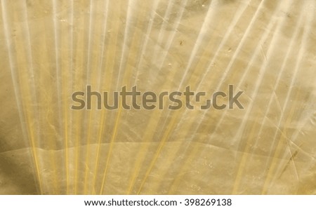 Yellow plastic film surface. Background and texture for design.
