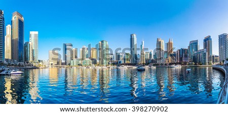 Panorama of Dubai Marina in a summer day, UAE Royalty-Free Stock Photo #398270902