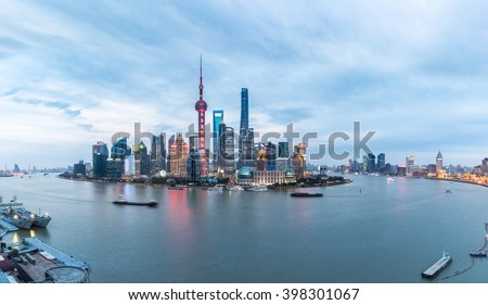 panoramic view of shanghai skyline and huangpu river in nightfall , China