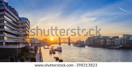 London, England - Sunrise with Iconic Tower Bridge and HMS Belfast cruiser ship