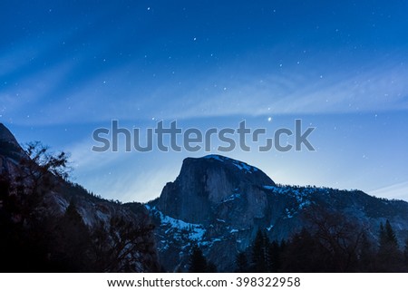 scene of half dome with sky at night before full moon set in Yosemite National park,California,usa.