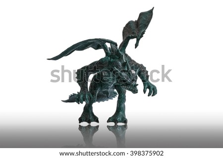 Monster green-dark  dragon toy isolated on white background