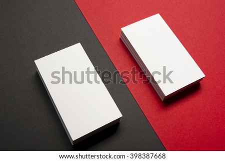 Business card blank over colorful abstract background. Corporate stationery branding mock-up