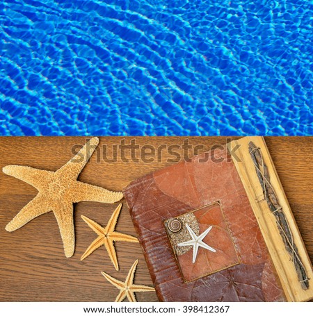 Photo album with starfish on a background of blue water.