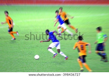 Blurred motion photo of Thai soccer players