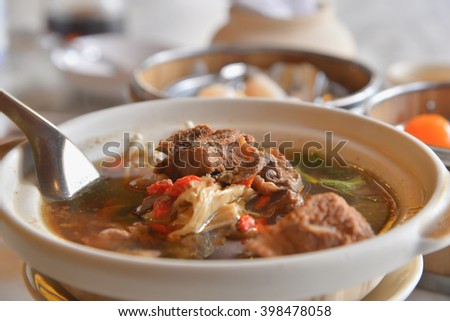 buk kut tae, chinese herbal soup (focus pork) Royalty-Free Stock Photo #398478058