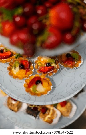 Fruity cupcakes on the white plates