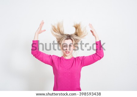 portrait of a young surprised girl on a white background