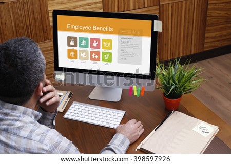 Man using computer with Employee Benefits concept on screen Royalty-Free Stock Photo #398597926