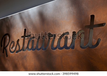 Close up of a rusty metallic sign