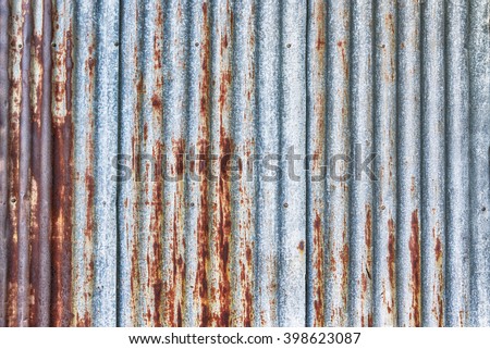 old rusty galvanized, corrugated iron siding vintage texture background  Royalty-Free Stock Photo #398623087