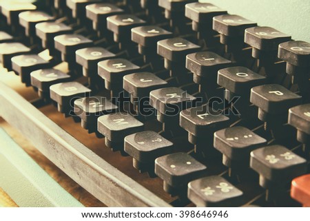 close up image of typewriter keys. vintage filtered. selective focus
