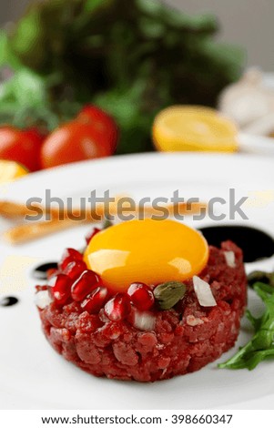 Beef tartare served on a plate, close up