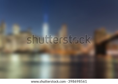 Defocused night view of Downtown Manhattan skyline from Brooklyn.