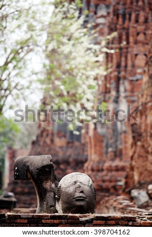 Head of ancient Buddha statue in Wat Mahathat, Ayutthaya, Thailand