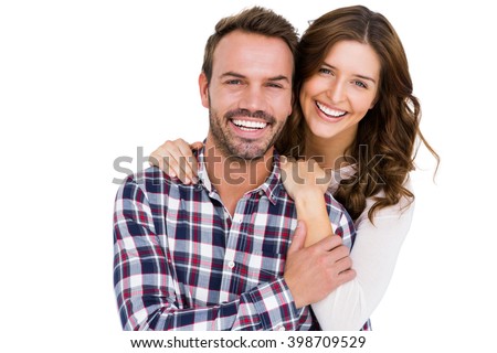 Portrait of young couple smiling on white background