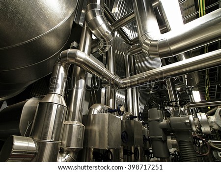 different size and shaped pipes and valves at a power plant                 