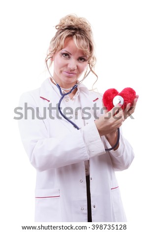 Medical examination of cardiology. Middle aged cardiologist with heart and stethoscope. Female doctor in white uniform makes measurement heartbeat. Isolated on white.