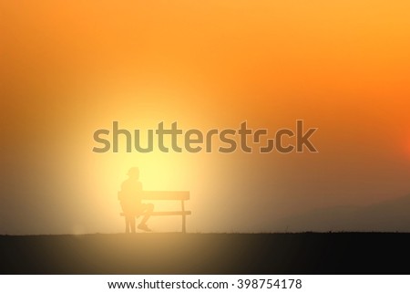 Silhouette of young traveler sitting on the chair (intentional v