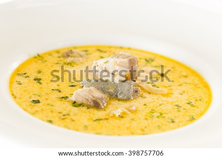 romanian traditional Soup with fresh fish and dumplings, natural light