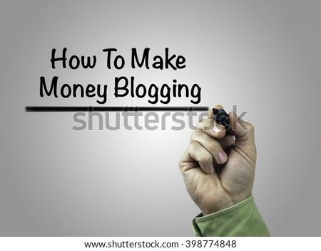 Hand with marker writing How to make money blogging
