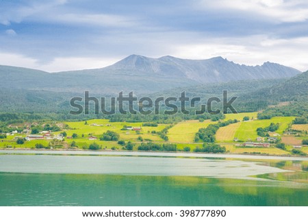 View of the green fields and fjords in Norway in summer