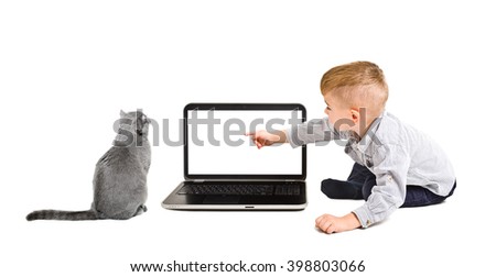 Kid points finger at the screen of laptop sitting with a cat isolated on a white background