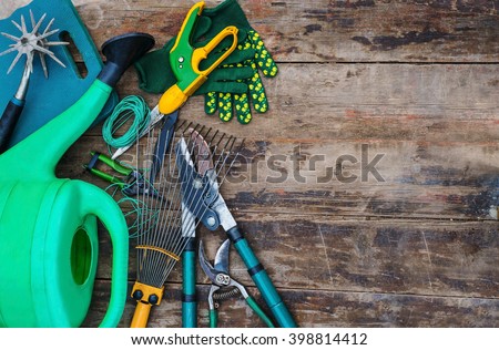 garden tools on a wooden table. view from above Royalty-Free Stock Photo #398814412