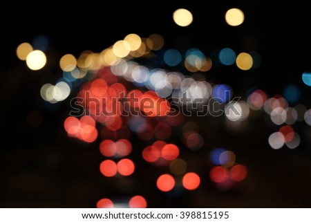 Bokeh, de-focused, traffic scene with car headlights