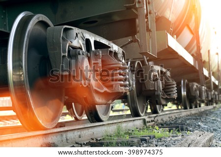 Railroad train of black tanker cars transporting crude oil on the tracks, with instagram style filter Royalty-Free Stock Photo #398974375