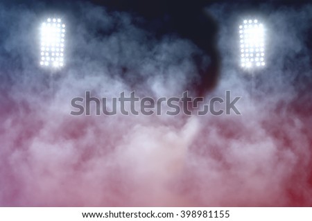stadium lights and smoke Royalty-Free Stock Photo #398981155