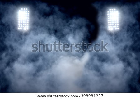 stadium lights and smoke Royalty-Free Stock Photo #398981257